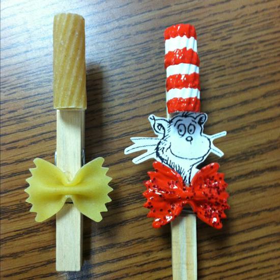 Cat in the hat craft using pasta, red and white paint, glitter, and a printable face.