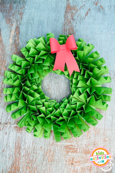 Image shows a christmas wreath paper craft from kids activities blog