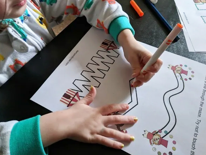 Circus Crafts and Carnival Crafts- Image shows a kid coloring a preschool circus printable. Idea from Darcy and Brian
