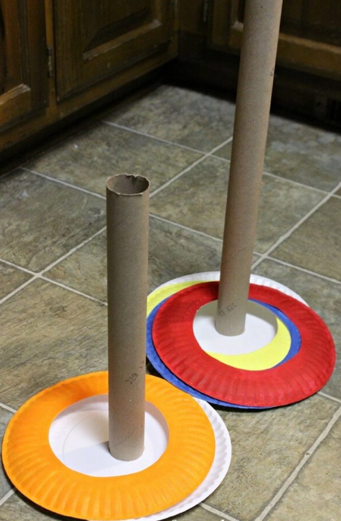 Circus Crafts and Carnival Crafts- Image shows a circus ring toss game for kids. Idea from From ABCs to ACTs