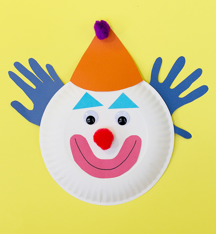 Circus Crafts and Carnival Crafts- Image shows a simple paper plate clown craft. idea from Kids activities blog