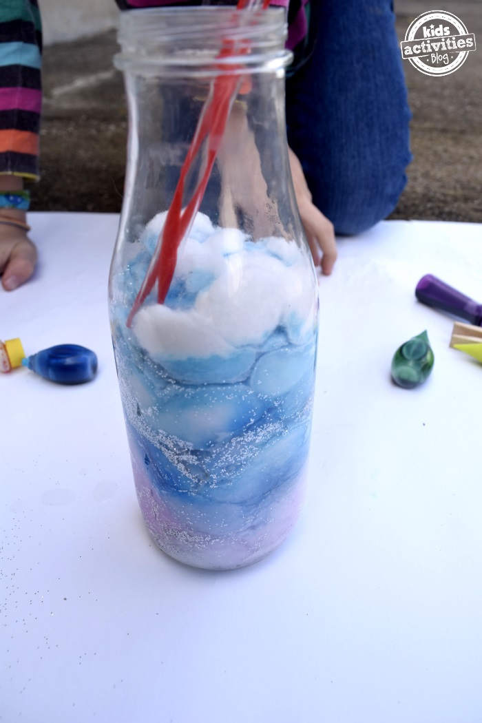 Step 5 - How to make a galaxy jar - use straws or sticks to push down the cotton balls