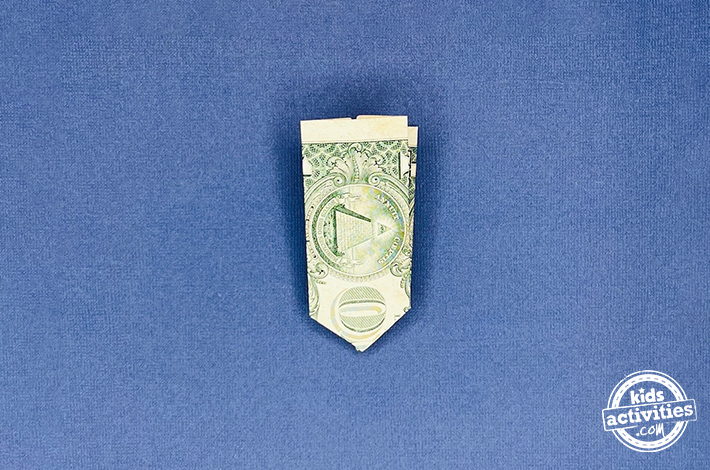 "Dollar bill origami pants - Step 5 - Fold the bottom left corner up, then unfold it to create a crease. 