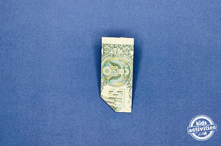 Dollar bill origami pants - Step 5 - Fold the bottom left corner up, then unfold it to create a crease. 