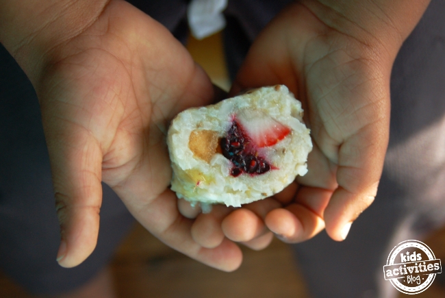 DIY Fruit sushi, frushi finished and in the hands of a child
