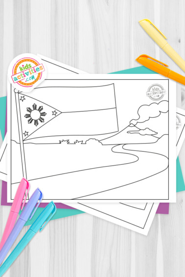Philippines flag coloring pages scattered with purple and greenish blue paper. The background is grey and pink, purple, greenish blue, and orange markers are ready to be used.