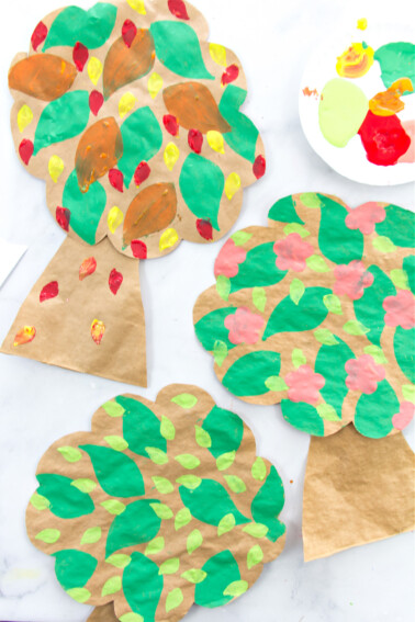 tree art and craft for kids made out of paper bags and paint