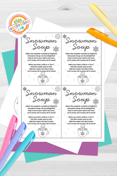 Black and white snowman soup sticker printable on top of blue-green and purple sheets with assorted crayons on a dark grey background. printed pdf version from Kids activities blog.
