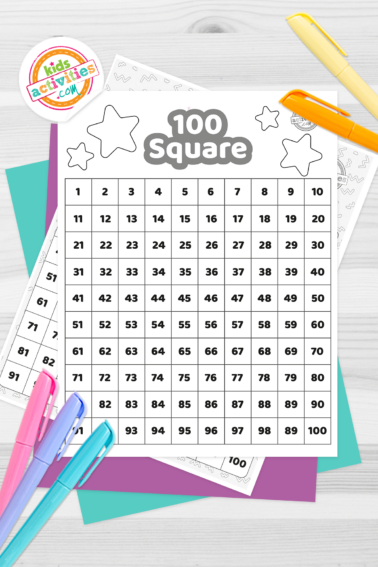Black and white 100 square printable on top of blue-green and purple sheets with assorted crayons on a dark grey background. printed pdf version from Kids activities blog.