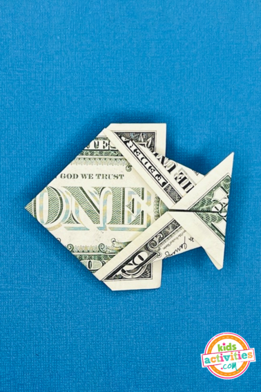 Finished result - dollar bill origami fish - tutorial for kids and adults by kids activities blog