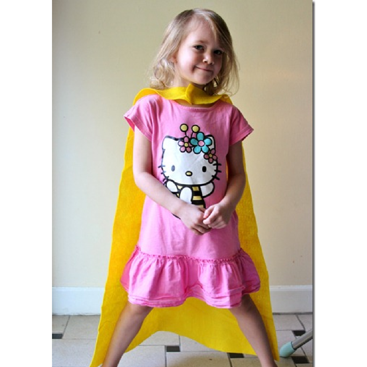 dress up ideas- super hero cape yellow on little girl with pink dress- kids activities blog