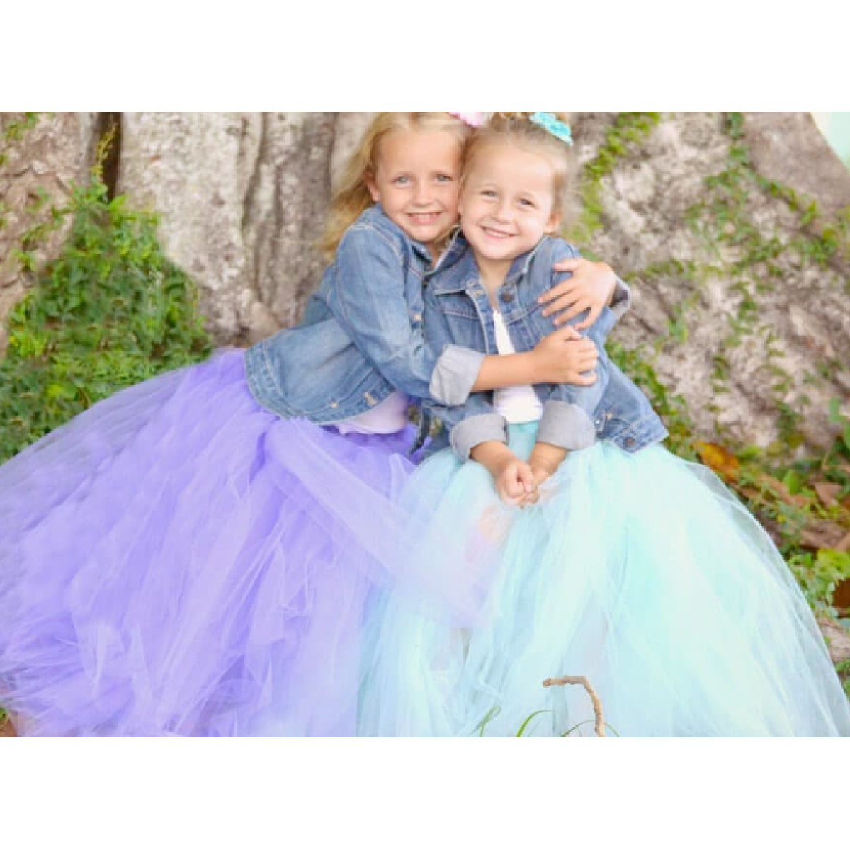 dress up ideas- blue and purple tulle skirts on 2 girls hugging by a tree- kids activities blog