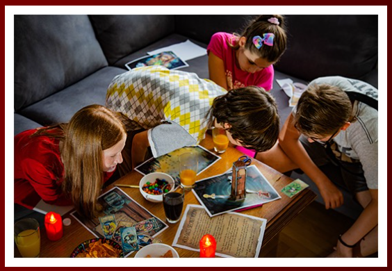 4 children trying to solve a printable escape room on a coffee table looking at the printable escape room pieces