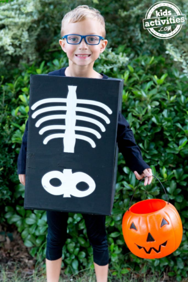 kids skeleton costume made from a black box with white bones painted on
