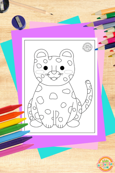 Leopard Coloring Page printed pdf on wooden background with coloring supplies- kids activities blog